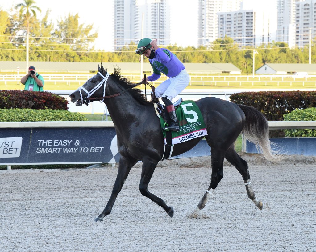 Colonel Liam riding horse back after winning championship race